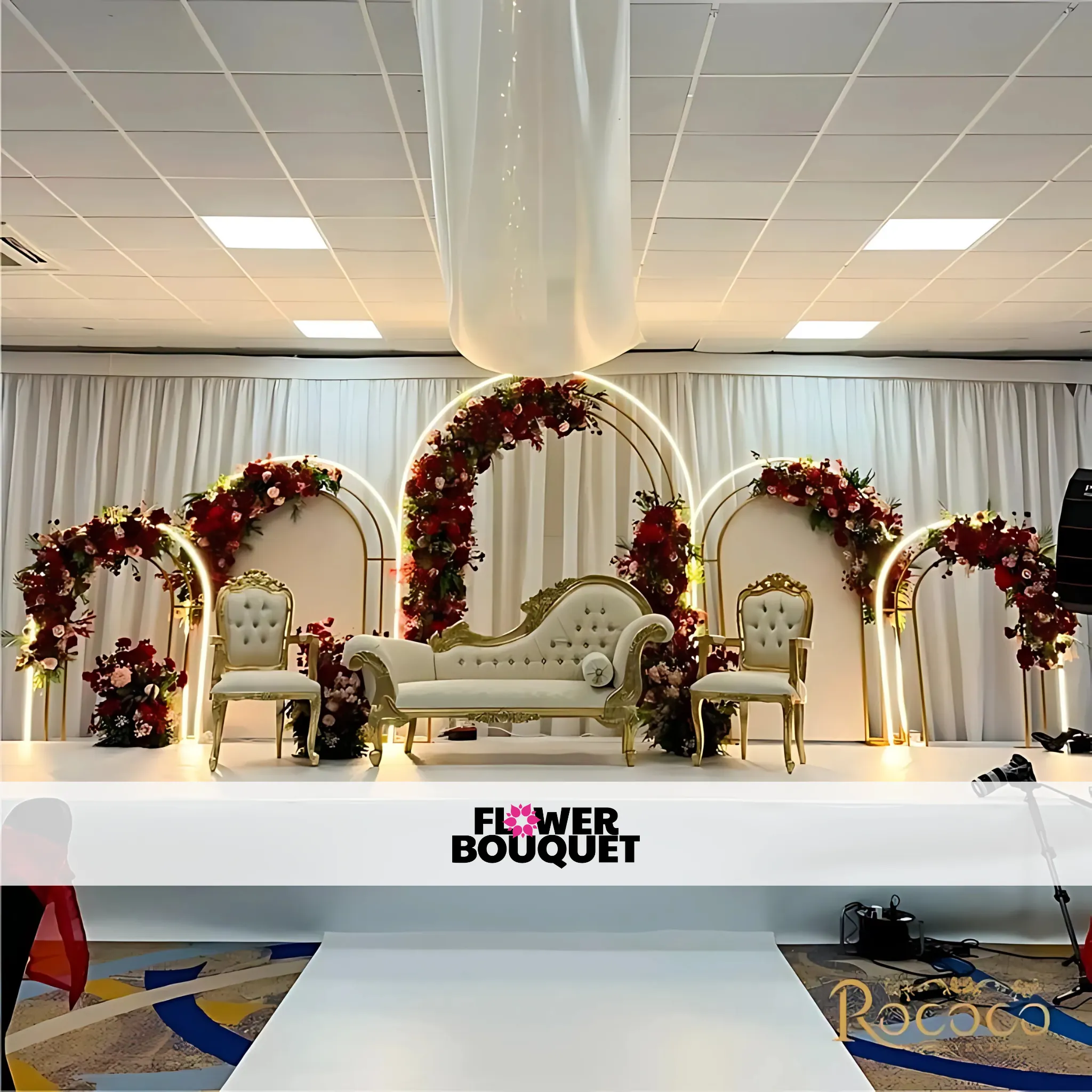 Modern Gold Arch Wedding Stage – Floral Elegance with Regal Seating"