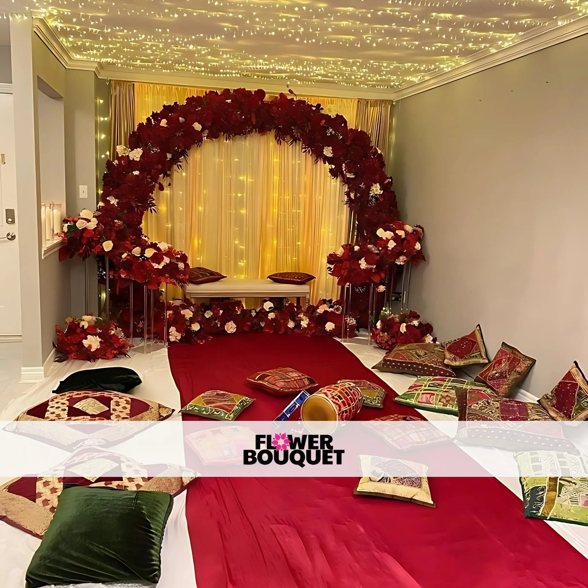 Luxurious Indoor Mehndi Setup with Red Floral Arch